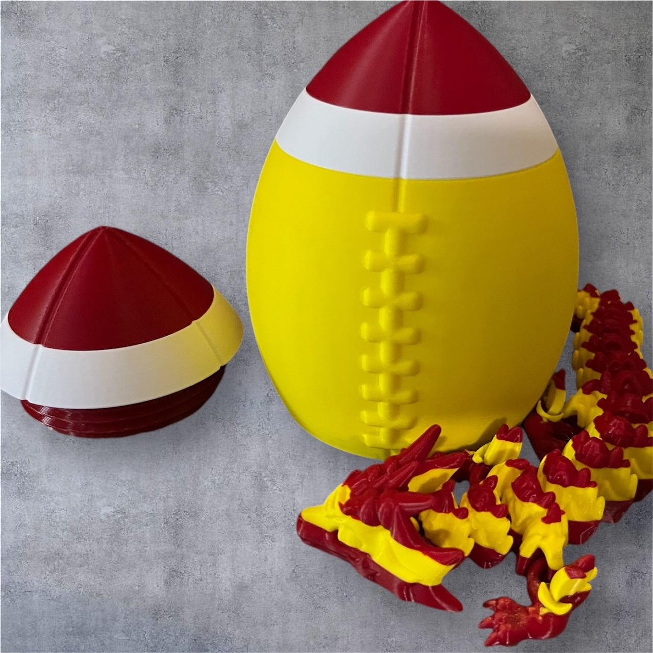 3D-Printed Football with Articulated Dragon Inside – A Unique Tribute to Your Team - Use as a fund raiser for school - Collect them all - Stress relief - ADHD - MADE IN THE USA