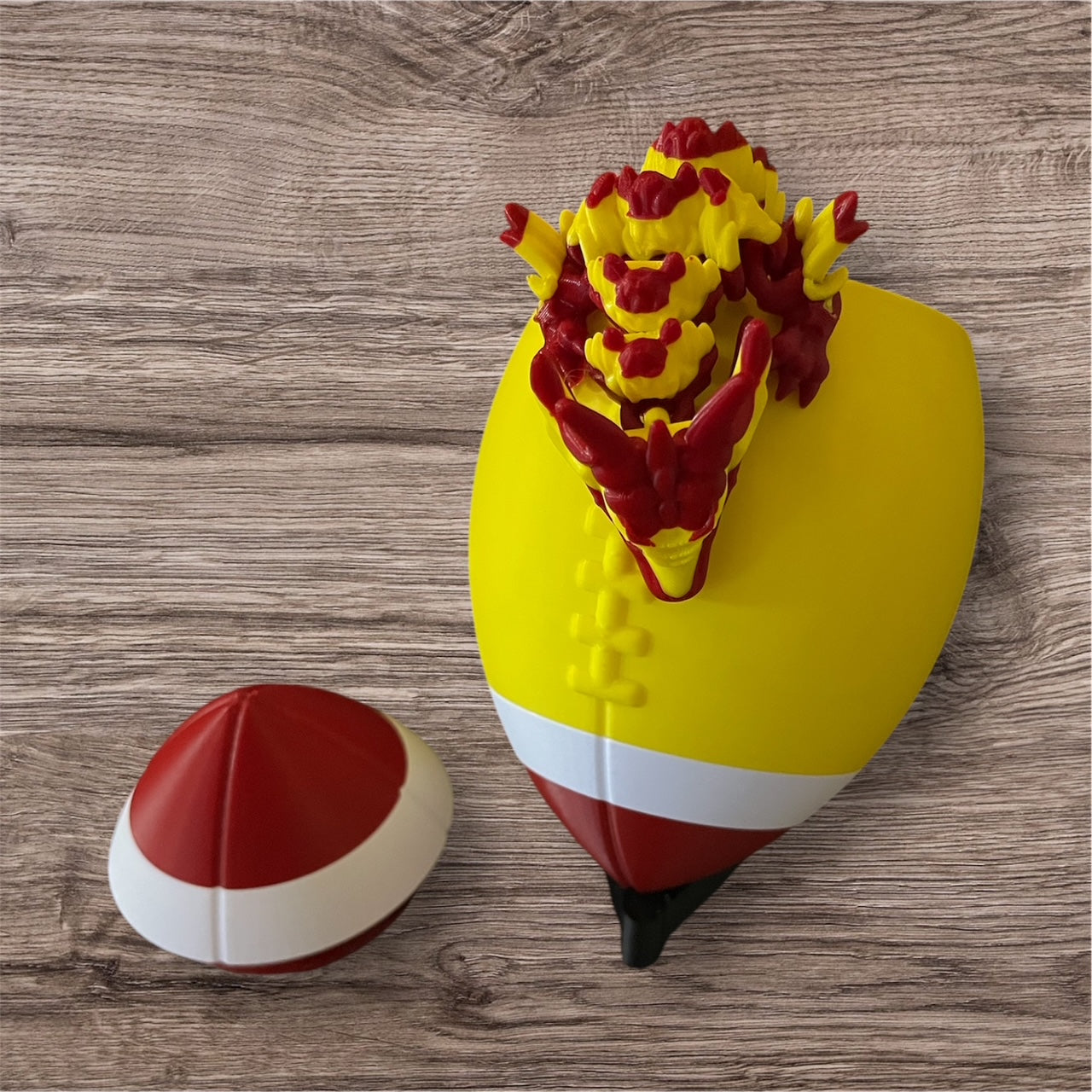 3D-Printed Football with Articulated Dragon Inside – A Unique Tribute to Your Team - Use as a fund raiser for school - Collect them all - Stress relief - ADHD - MADE IN THE USA