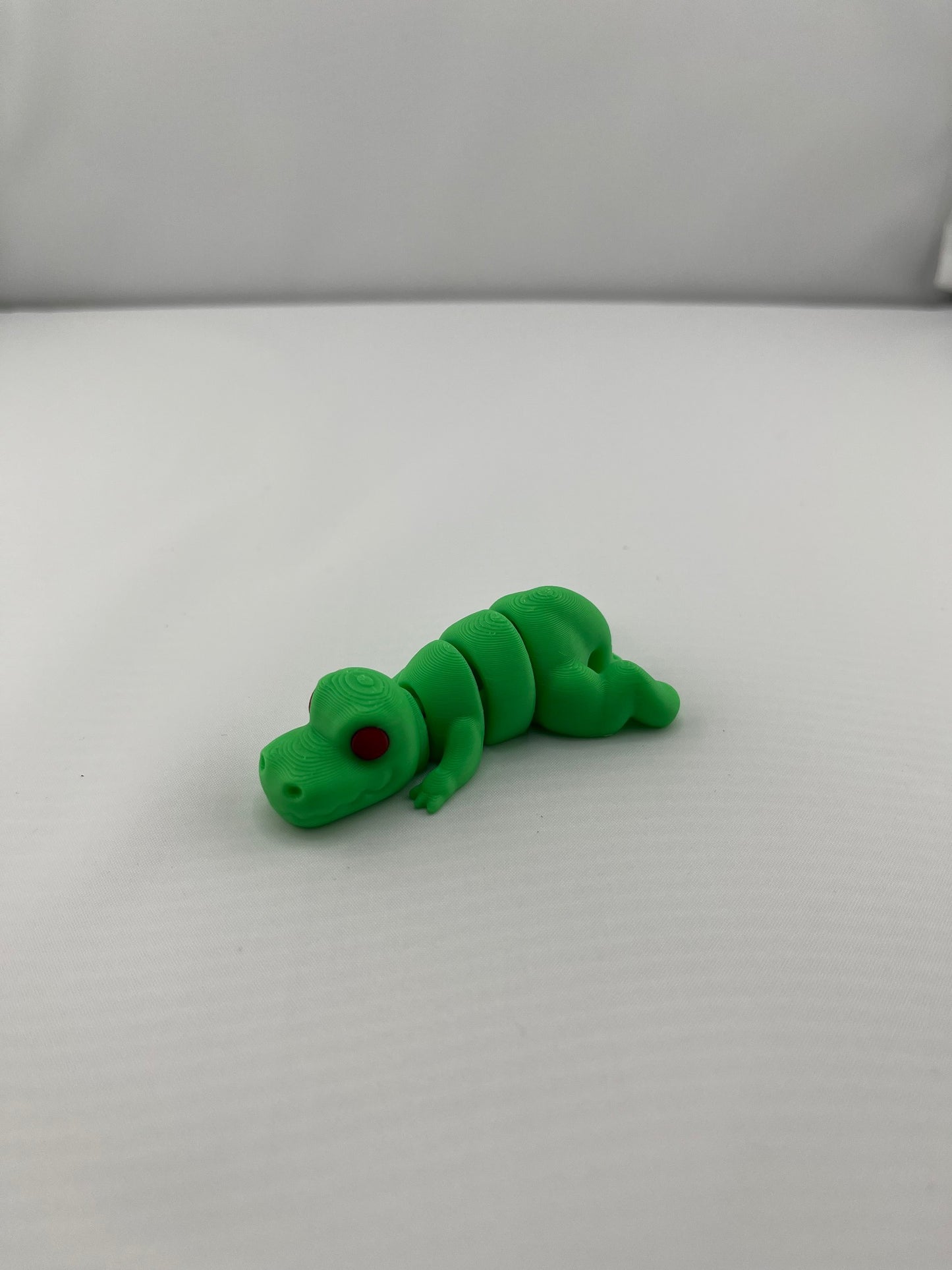 Flexible Articulated T-Rex - Tiny 3D Printed Fidget Toy - Various Sizes Available - Team Mascot - Use as a fund raiser for school - Collect them all - Stress relief - ADHD - Key Chain - Zipper Pull - Pal for your pocket - MADE IN THE USA