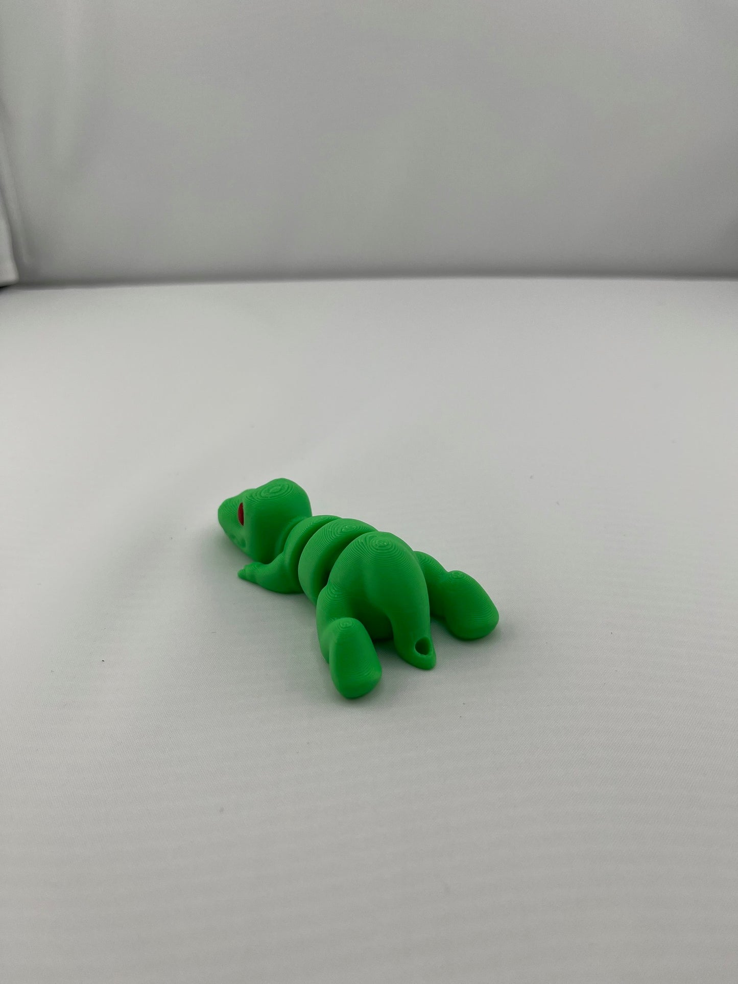 Flexible Articulated T-Rex - Tiny 3D Printed Fidget Toy - Various Sizes Available - Team Mascot - Use as a fund raiser for school - Collect them all - Stress relief - ADHD - Key Chain - Zipper Pull - Pal for your pocket - MADE IN THE USA