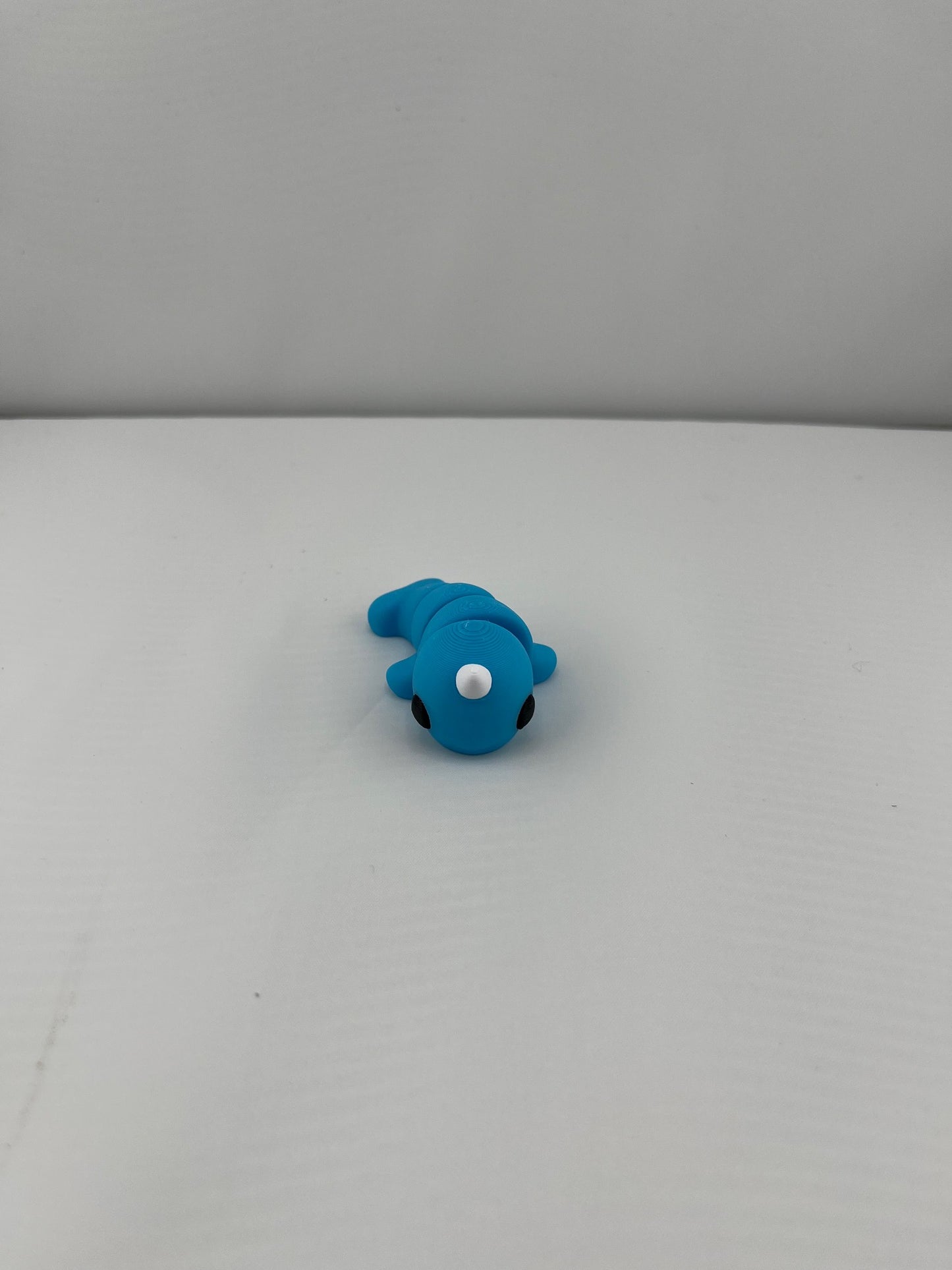 Flexible Articulated Norwal - Tiny 3D Printed Fidget Toy - Various Sizes Available - Team Mascot - Use as a fund raiser for school - Collect them all - Stress relief - ADHD - Key Chain - Zipper Pull - Pal for your pocket - MADE IN THE USA