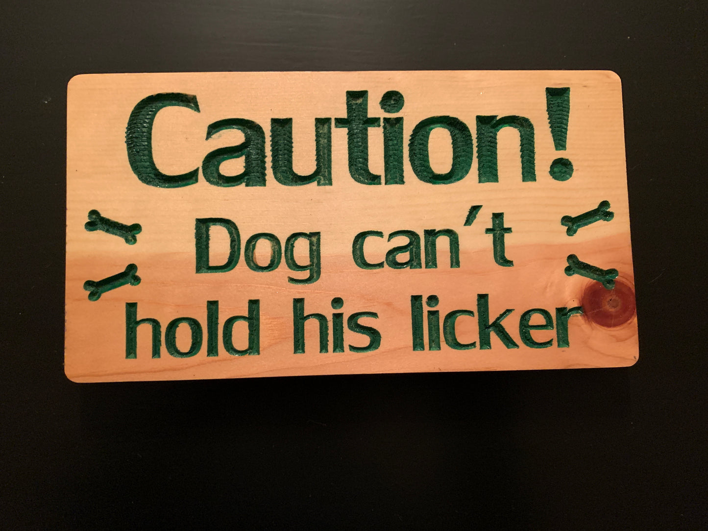 "Caution! Dog can't hold his licker" sign